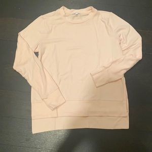 Beautiful soft pink sweater over workout clothes